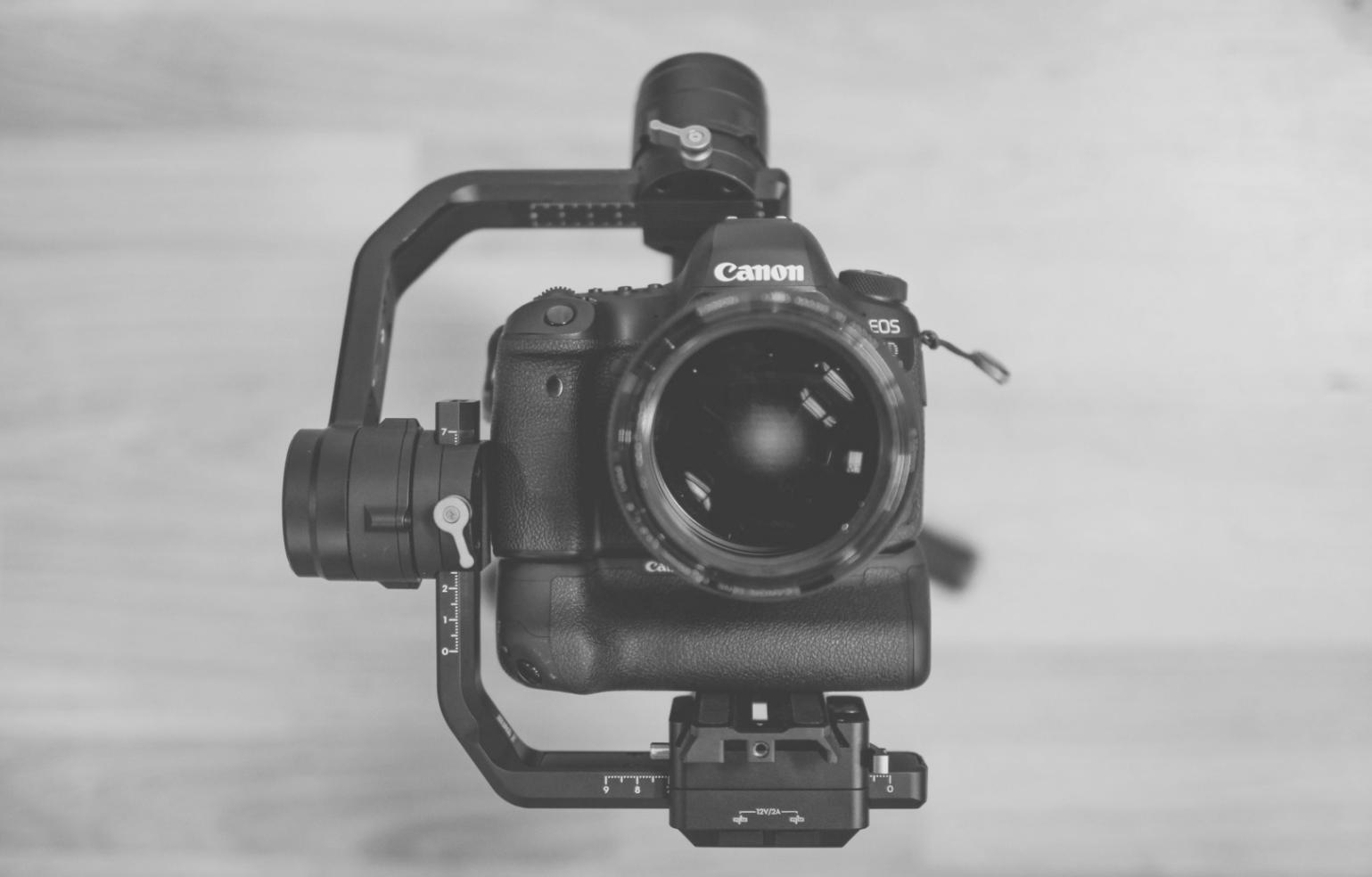 Professional colorist working at grading station with client during review session