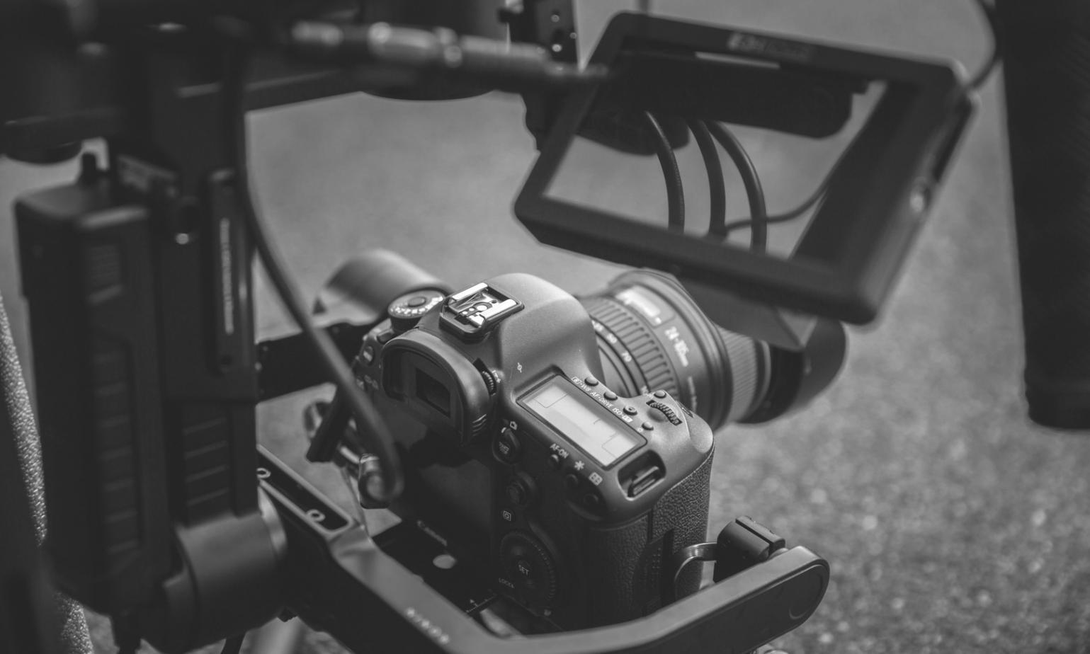 Color grading session in progress with instructor guiding student through advanced techniques on professional editing suite