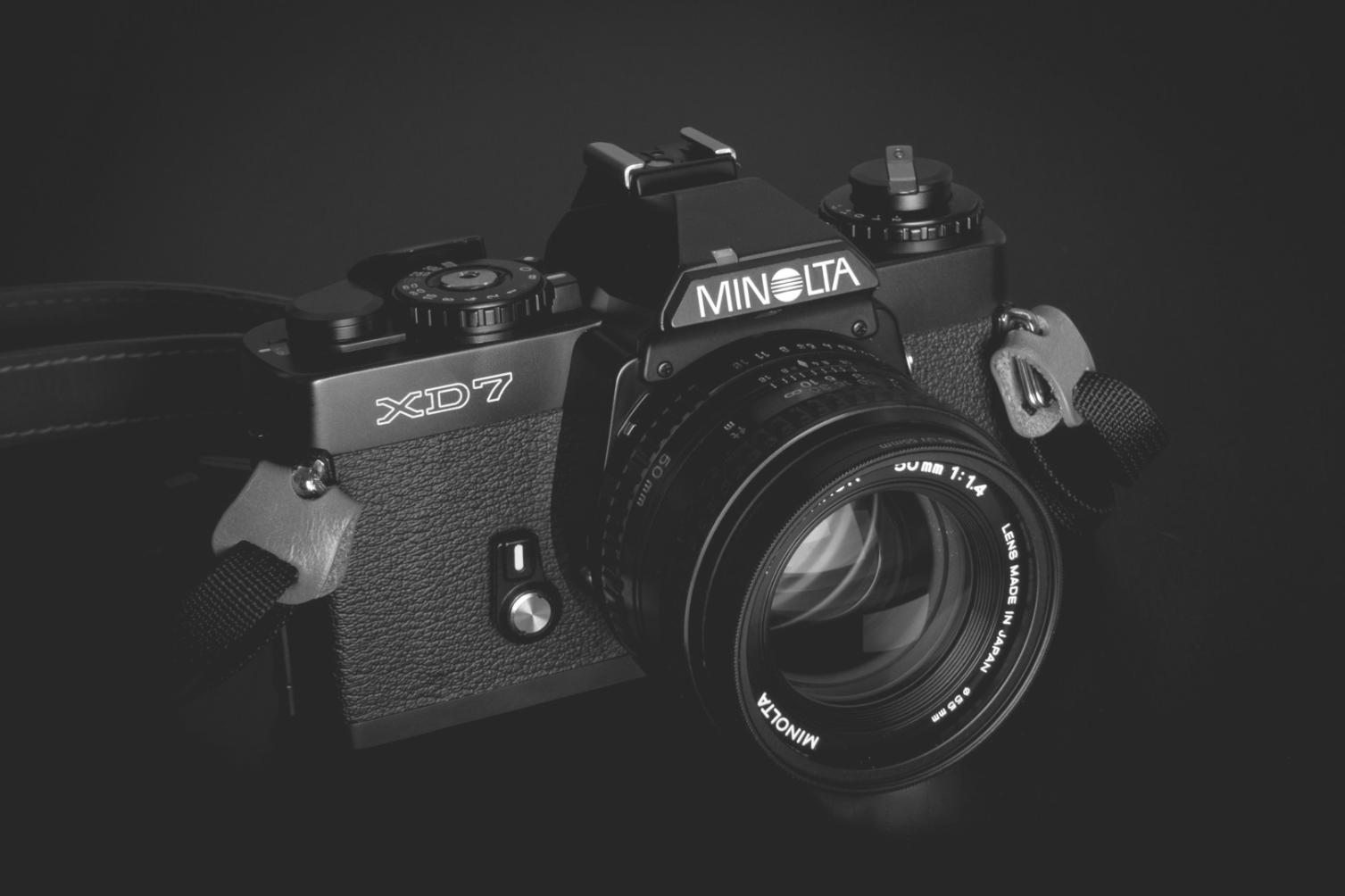 Professional color grading workspace showing multiple monitors and calibrated equipment